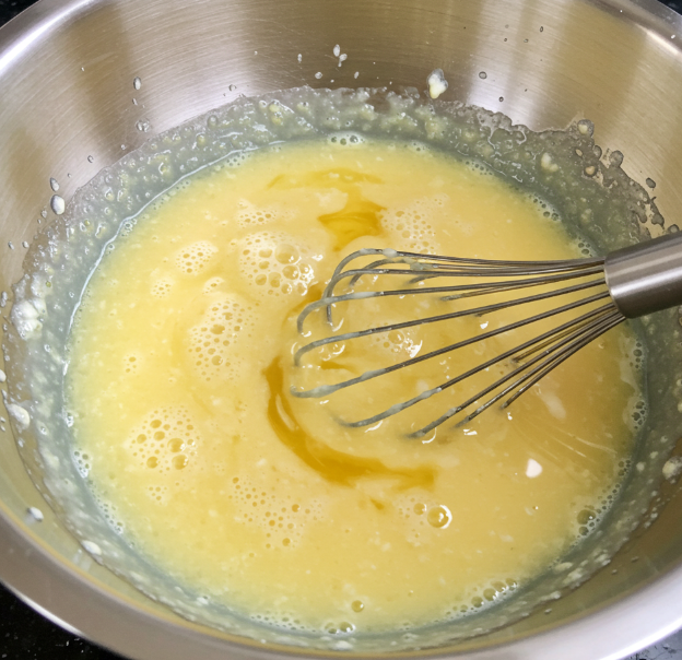 Wet ingredients being whisked together